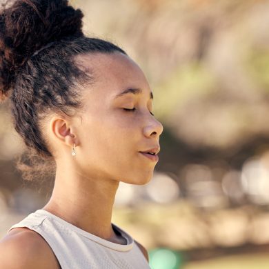 Woman, mediation and yoga with breathing, exercise and zen outdoor in a nature park in spring with .